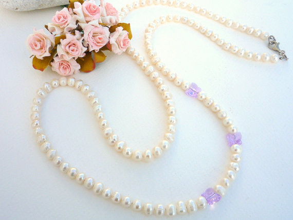 Long freshwater Pearl necklace with Swarovski butterflies.